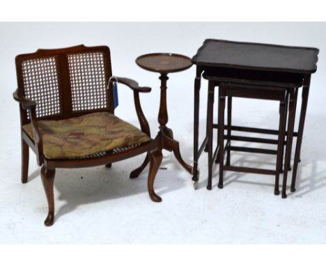 A mahogany low elbow chair with cane seat and back, width 57.5cm, an Edwardian starburst inlaid circular tripod wine table, a