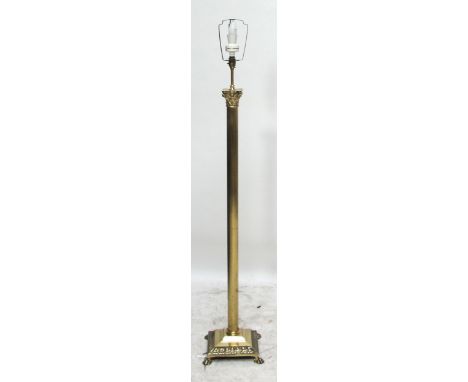 A contemporary brass Corinthian column fluted standard lamp.