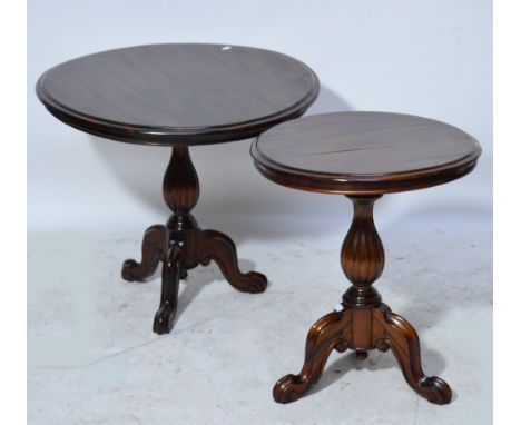 Two reproduction circular occasional tables with baluster shaped fluted supports above tripod cabriole legs to scroll feet, l