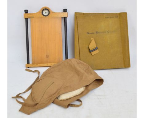 A military cartographer's map holder with leather strap, compass point signed "Aston & Mander London", a roll of paper, an Ar