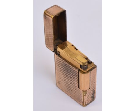 A St Dupont rolled gold lighter with overall engine turned decoration, 4.7 x 3.5cm.