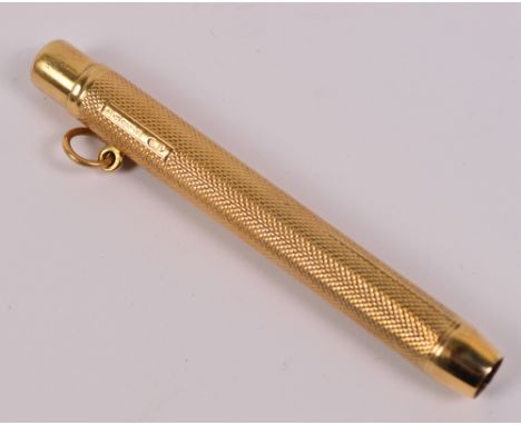 A 9ct yellow gold propelling pencil with engine turned decoration, centred with a rectangular cartouche engraved "ML Xmas 195