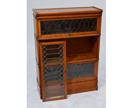 A Globe Wernicke oak three section stacking bookcase with leaded glazed doors, height 120cm, width 87cm.