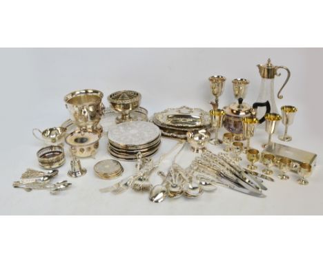 A large quantity of plated items including trays and salvers, claret jug, place mats, teapot, goblets, etc.