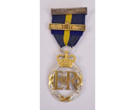An Elizabeth II Army Emergency Reserve Decoration with Army Efficiency Reserve bar and ER bar, the reverse stamped 1959.