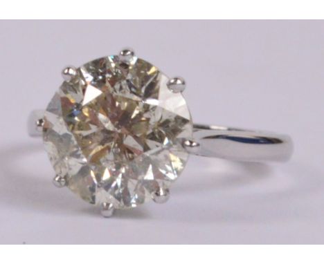 An 18ct white gold diamond solitaire ring, the round brilliant cut stone weighing approx 4.5cts, in high claw setting, size K