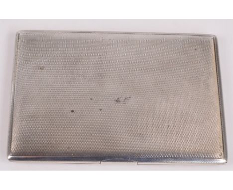 A George V hallmarked silver cigarette case of rectangular form with push button action and internal inscription "To Allan wi