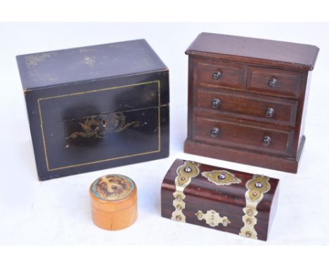 A miniature mahogany chest of two short above two long drawers, width 20cm, a chinoiserie decorated black lacquered tea caddy