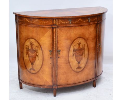 A good quality reproduction mahogany demi-lune side cabinet, the radially veneered crossbanded top set with a broad inlaid pa