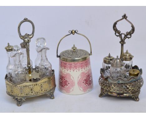 A Victorian electroplated six piece cruet stand with pierced and engine turned decorated sides, and with central loop handle 