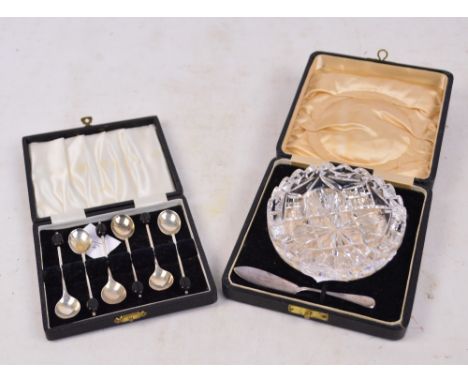 A cased set of six Elizabeth II Coronation hallmarked silver bean finial coffee spoons, Atkin Bros, Sheffield 1953, and a cas