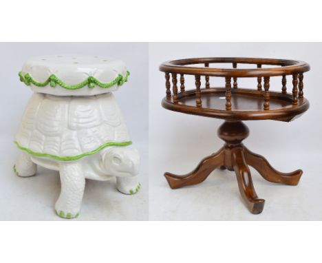 A reproduction oval occasional table with gallery, 58 x 42cm, and a ceramic garden seat modelled as a turtle with pillow on i