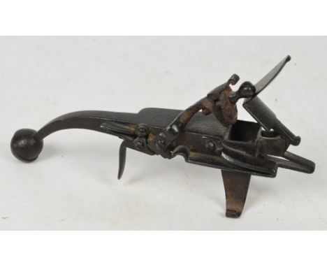 A cast iron flint scratch built tinder lighter, length 19.5cm.