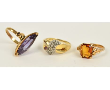 A 14ct yellow gold ring set with a marquis cut amethyst, size N, a 10ct yellow gold dress ring set with a swathe of diamond c