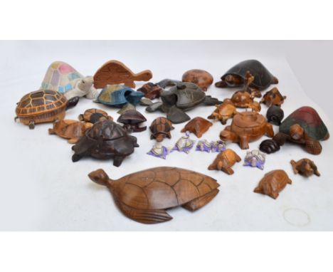 A collection of various carved wooden figures of tortoises, some acting as trinket boxes, ashtrays, also a set of six pickle 