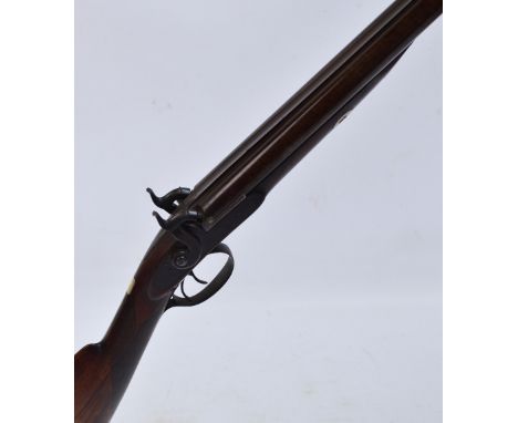 A 15 bore side by side muzzle loading percussion cap hammer gun, with chequered walnut stock and 30" skelp barrels. CONDITION
