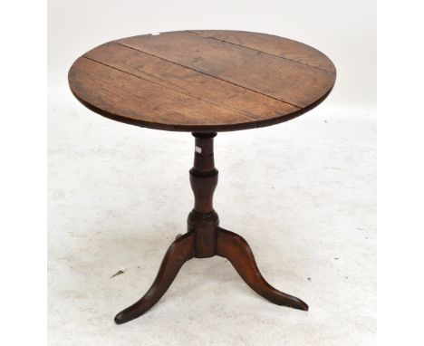 A Georgian oak circular tilt top tripod table on central turned column and cabriole legs, diameter 75cm. CONDITION REPORT: On