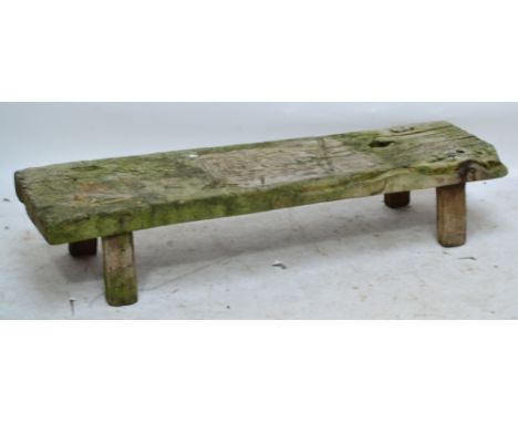 A low rustic wooden plank bench, length 145cm, height 29cm.