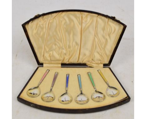 A cased set of six George V hallmarked silver and enamel coffee spoons with spreading bowls and differently coloured enamel s