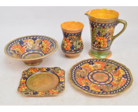 CHARLOTTE RHEAD; five Crown Ducal pieces tube line decorated with floral motifs within decorative borders on mottled orange g