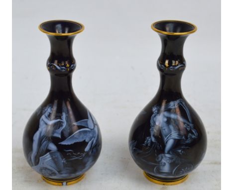 A pair of late 19th/early 20th century Meissen pate-sur-pate decorated vases of baluster form with knopped necks and gilt hei