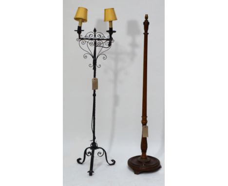 A wrought iron two branch standard lamp with wrythen stem on tripod scrolling base, height 146cm, and a further wooden exampl