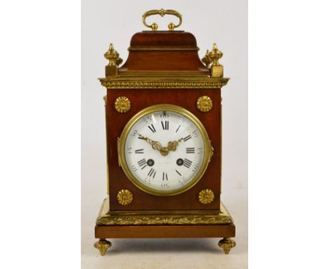 A late 19th century walnut and lacquered brass mounted eight day mantle clock, the movement stamped Medaille d'Argent, and th
