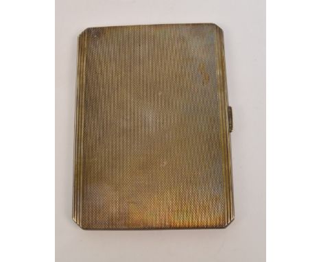 A George VI hallmarked silver cigarette case of rectangular form with canted corners, with overall engine turned decoration a
