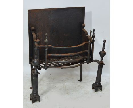 A large cast iron grate with bowed front, finial decoration and scrolling sides with pillar and finial supports, width 88cm, 