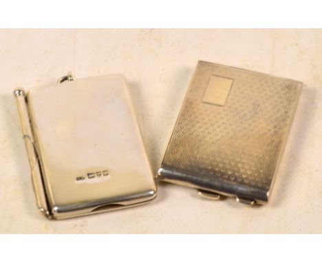 An Edward VII hallmarked silver notepad holder of plain rectangular form with hinged front lid and with pencil holder acting 