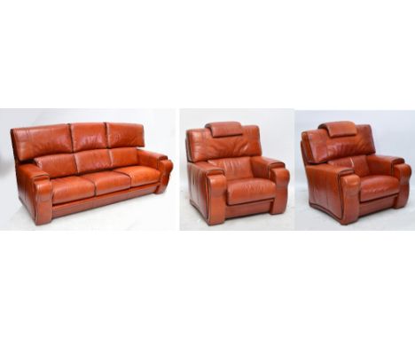 A large contemporary tan leather three piece suite comprising a three seater sofa and two armchairs, with removable cushions 