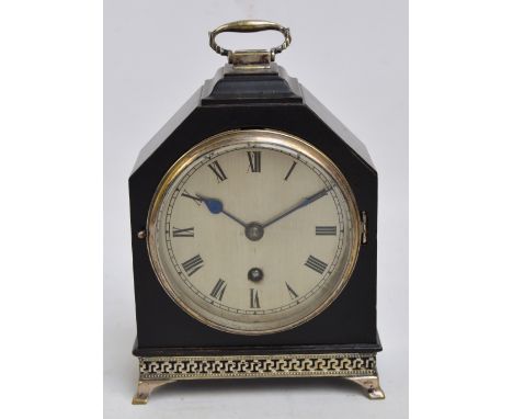 An early 20th century ebonised and silver plate mounted mantel clock, the swing loop handle above silvered dial set with Roma