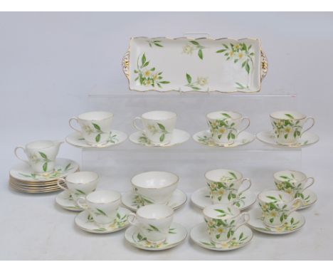 A Shelley part tea and coffee service in Syringa pattern comprising jug and bowl, six tea plates, six tea saucers, five teacu