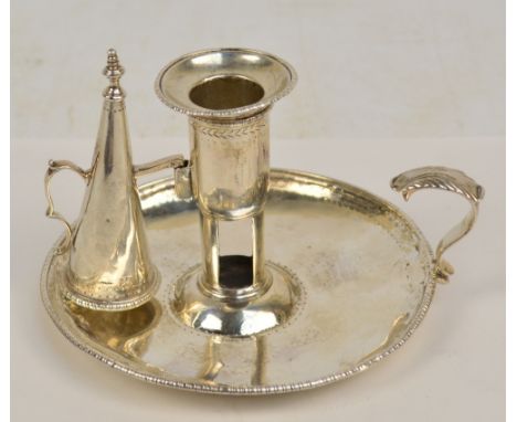 A George III hallmarked silver chamberstick with leaf capped C-scroll handle, pin prick decoration and detachable nozzle abov