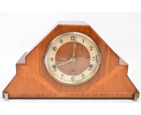 An Art Deco walnut cased triple chime mantel clock, the silvered chapter ring set with Arabic numerals, the movement stamped 