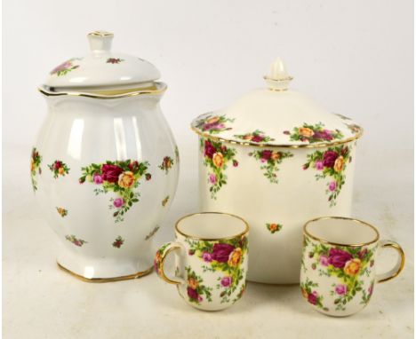 A large Royal Albert "Old Country Roses" pattern biscuit barrel of cylindrical form, boxed with a pair of mugs, and a lobed b