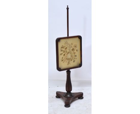 An early Victorian rosewood pole screen, the embroidered panel set with flowers above a lobed baluster ring turned central co