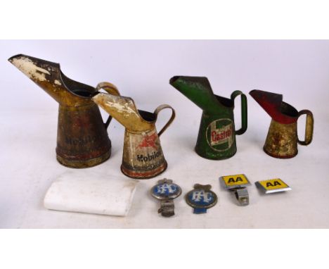 A small collection of automobilia comprising four oil jugs including Castrol, Mobil oil etc, also two RAC car badges and two 