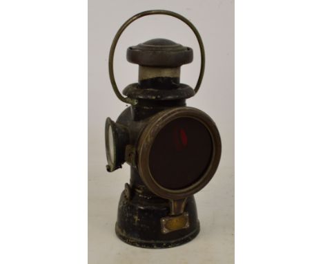 A "King of The Road" carriage lamp, Lucas No.43 by Jo.S.Lucas Ltd of Birmingham, with red tinted front glass, height 27cm.