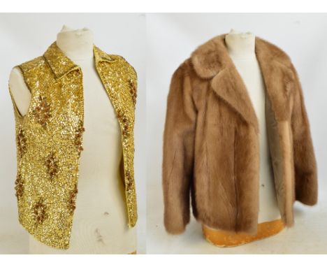 A pale mink jacket with shaped collar and button feature cuffs, with coffee silk lining, and a vintage gold sequinned sleevel