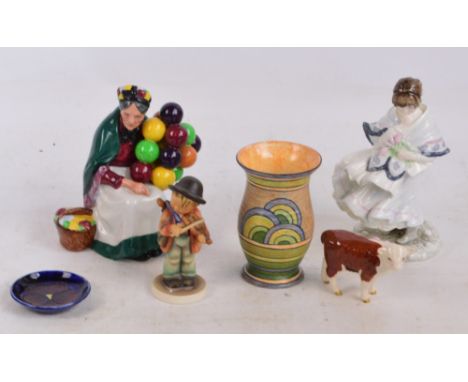 A Royal Doulton figure; HN1315 "The Old Balloon Seller" and a quantity of ceramics comprising a Moorcroft pin dish in the "An