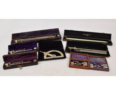 A large cased planimeter, a cased Hilger & Watts glass 15" scale, cased Reifler protractor, two small cased planimeters (one 