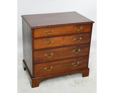GILLOWS; an early 19th century mahogany chest of small proportions, with four long graduated drawers, brass drop handles and 