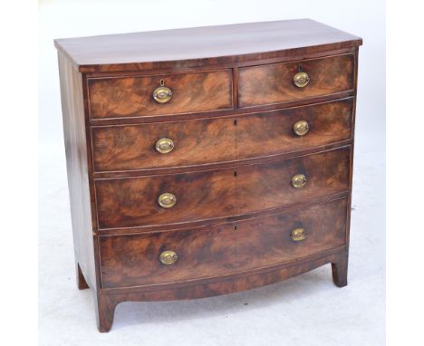 A George IV mahogany and crossbanded chest of two short and three long drawers on splayed bracket feet, width 106cm, depth 53