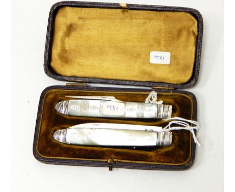 A Georgian silver knife and folding fork set with mother-of-pearl handles, insert metal decorations, marked indistinctly, cas