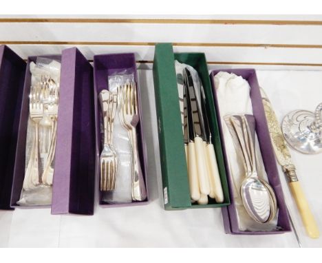 A quantity of Old English pattern tableware for six people, to comprise dessert spoons, knives and forks, a set of fish knive