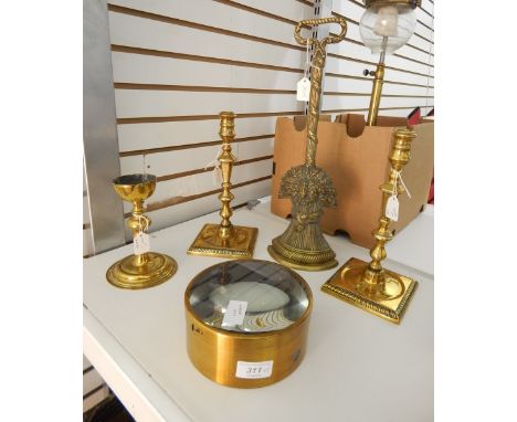 Various brass items including a brass doorstop modelled as a sheaf of wheat, a pair of brass candlesticks, a single brass can