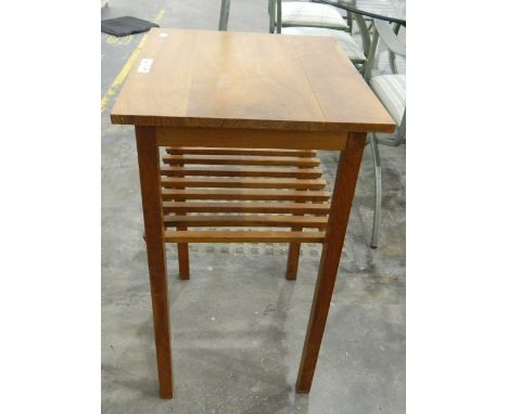 A walnut rectangular top side table, with open rack shelf below, on square legs, width 53cm