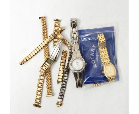 A gold-coloured lady's Rotary battery watch with several different links and extensions (including International Guarantee an