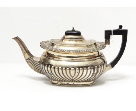 A late Victorian silver teapot by John Round & Son, Sheffield 1896 of oval half-fluted form, 24oz approx. 